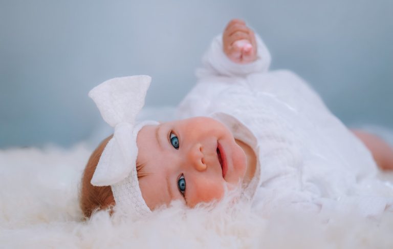 A peaceful sleeping baby wrapped in a soft blanket.